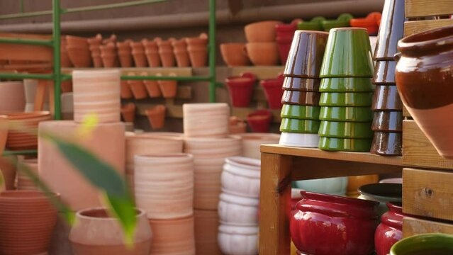View of ceramic flower pots for indoor plants for sale at the horticultural market. High quality 4k footage