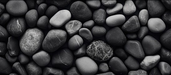 Gray stones creating a contrast against the black and white backdrop