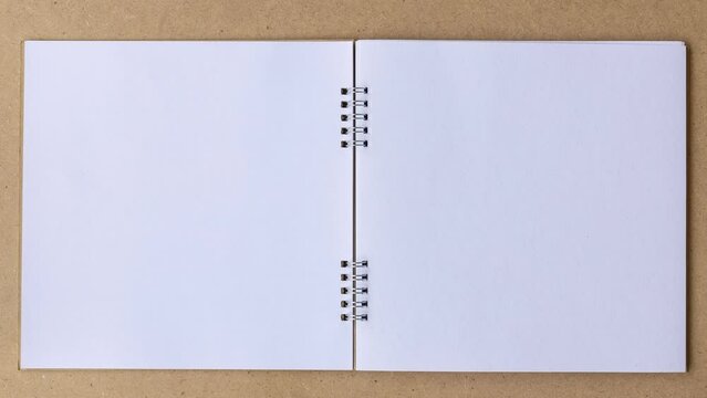 open notebook with blank pages.4k stop motion of book document animation open blank page