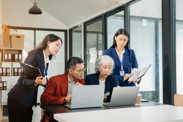 Young business creative team are brainstorming planning discussing while sitting in office