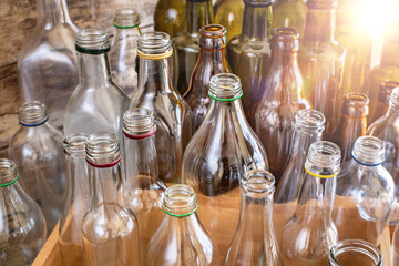 Many different types of bottles. A variety of glass bottles and jars. 