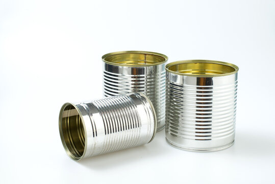 Aluminum can isolated on white background. Metal open can no lid preserve for generic food factory. Pile of cans of conserved food industry packaging. Clean tuna tin steel container pack technology .