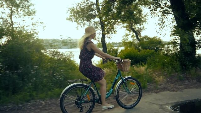 Cyclist girl wearing dress workout . Vacation holiday fun sport	