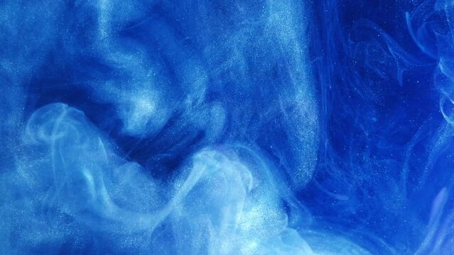 Vertical video. Ethereal smoke background. Mysterious cloud. Blue white paint glitter particles swirls stream wave flow in water liquid pantone ink abstract art.