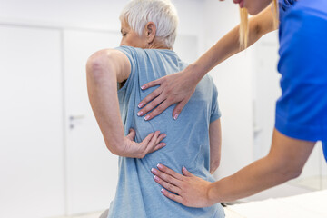 Senior woman having chiropractic back adjustment. Osteopathy, Alternative medicine, pain relief...