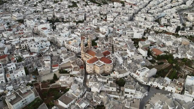 Aerial landscape view over a traditional italian village with white buildings