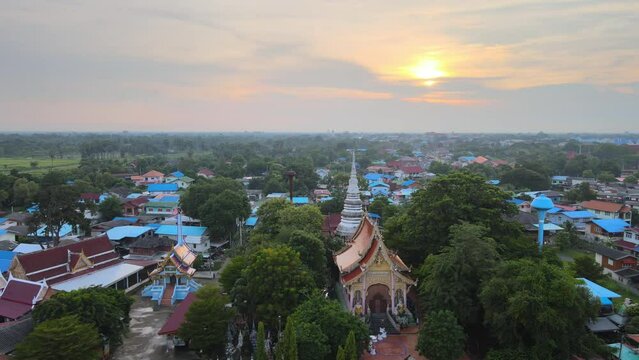 Aerial drone view of Buddhist temple Wet Bang Kacha at sunset, Ayutthaya, Thailand