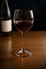 glass of red wine and bottle