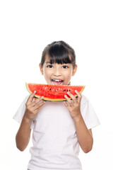 Young Asian girl eating watermelon isolated on white background with clipping path.