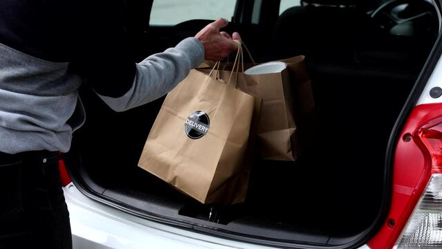 Delivery driver brings the order to the house