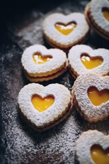 Obraz na płótnie Canvas Heart-shaped thumbprint cookies with orange jam, Valentine's Day dessert idea food photography