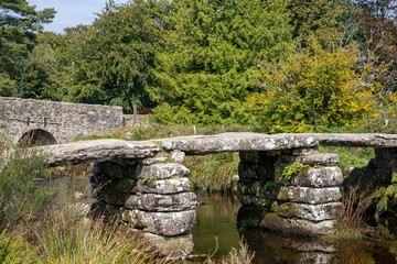 Fototapeta na wymiar Postbridge Dartmoor Medieval Clapper bridge 