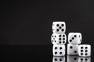White dice on black background studio shot