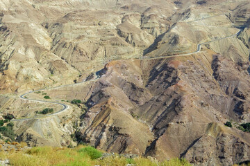 asphalt road in the middle of the rocky mountains in a breathtaking landscape