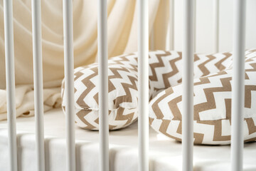 White wooden baby crib with pillow in nursery room - obrazy, fototapety, plakaty