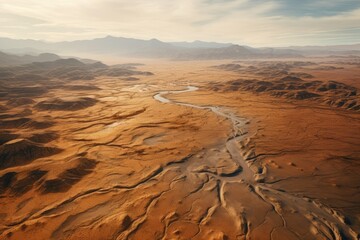 Fototapeta na wymiar Aerial view showcasing a vast desert landscape through the lens of a drone