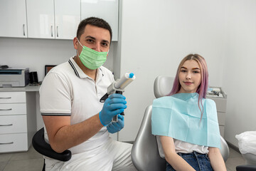 examination of a dentist treating a female patient who came to him with complaints.