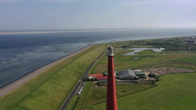 Drone shot, drone flight from the lighthouse Huisduinen, called the long Jaap with the North Sea in the background, Nieuw Den Helder, Huisduinen, province North Holland, Netherlands