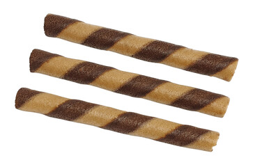 Three brown striped wafer rolls isolated on white background with clipping path. Close up view of rolled waffle sticks with chocolate filling.