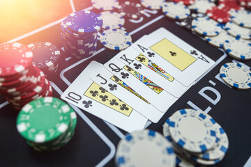 winning combination of playing cards and chips in poker club