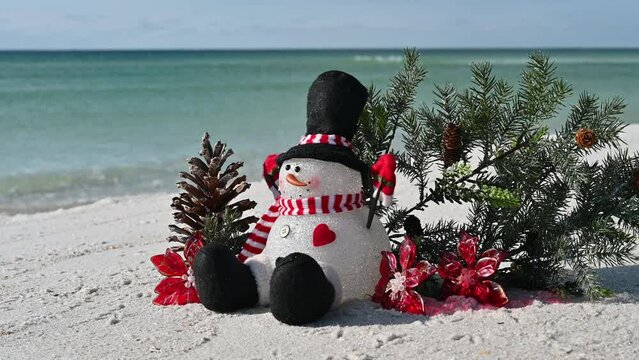 Christmas on beach snowman on a sunny winter day