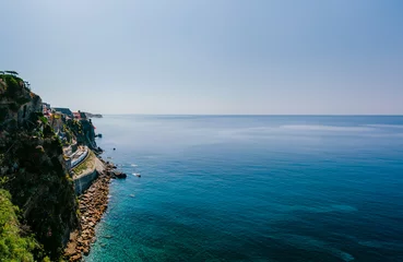 Zelfklevend Fotobehang Liguria, Italy Mountain Beside Body of Water  © Dave