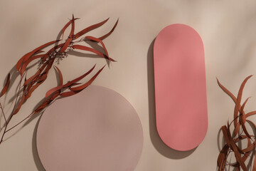 Two podiums in round and rounded rectangle shaped displayed with red leaves. Autumn is a time when...