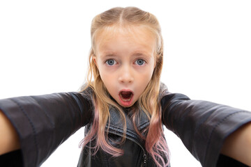 Portrait of wondered five year old girl reaching hands forward to the camera isolated on white background. Cute blonde child with open mouth posing in studio. Human facial expressions and emotions.