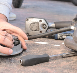 Mechanic Fixing The Variator Of A Motor Scooter