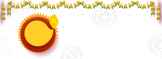 Indian Festival of Lights Celebration Concept with Top View of Illuminated Oil Lamp (Diya) and Floral Garland (Toran) Decorated in Background.
