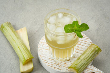 Fresh sugar cane juice (Es Tebu) in glass. Indonesian drink.
