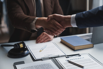 Lawyers shake hands with business people to seal a deal with partner lawyers or a lawyer discussing...