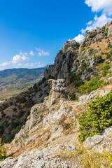 Mysterious mountain landscape of the Valley of Ghosts, a cluster of strangely shaped rocks on the western slope of Mount Demerdzhi in Crimea