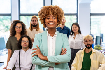 Proud african entrepreneur standing with arms crossed in a coworking