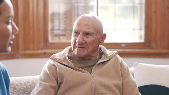 Medical, discussion and doctor with senior man in living room for diagnosis or treatment plan. Conversation, healthcare and female caregiver explaining medicare to elderly patient in nursing home.