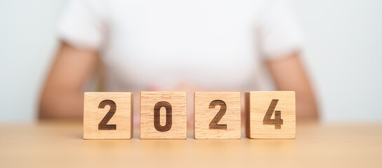 2024 year block on table. goal, Resolution, strategy, plan, start, budget, mission, action,...