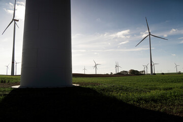 huge wind turbine blue sky, green field, energy, renewable