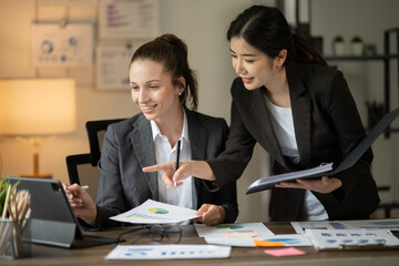 Asian businesswomen and talk about new projects, presents at home office.