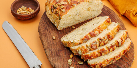 Fresh bread with pumpkin seeds. Home baking concept. Autumn decor