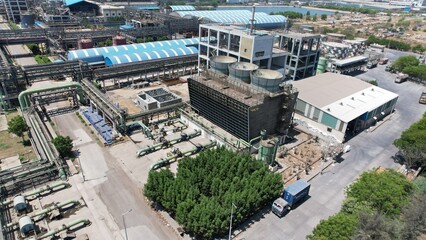 Chemical energy industry site power manufacturing factory pipe gas line top drone view smoke air...