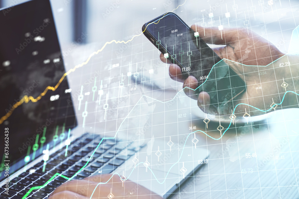 Poster close up of male hands using laptop and cellphone at desk with glowing forex chart and grid on blurr