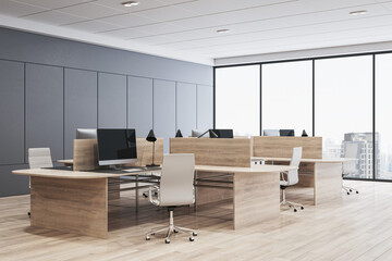 Clean coworking office interior with panoramic windows and city view, daylight, wooden flooring, furniture and decorative plant. 3D Rendering.