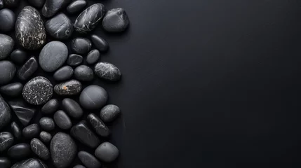 Foto auf Leinwand Top view. Bunch of black stones on the surface, copy space © standret