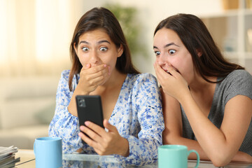 Amazed women watching media on phone