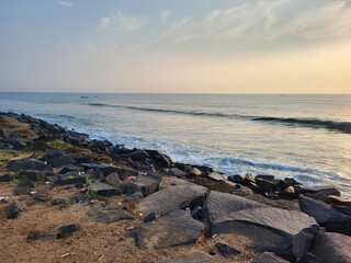 Fototapeta na wymiar Puducherry, India - Oct 17 2023: Sun rise at Rock Beach in Pondicherry.