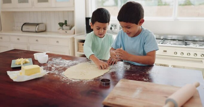Kid, together and bake with high five in kitchen with dough for development with skill and learning. Cookies, sibling and happy with flour in home or winning with target or success for bond or youth.