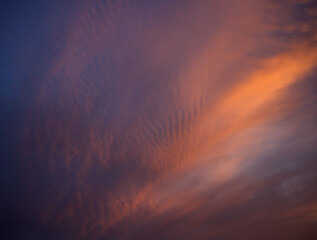 Sunset sky with orange clouds. Nature background.
