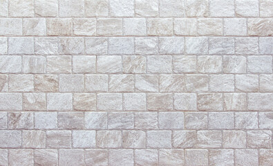 Obraz premium Empty background of wide cream brick wall texture. Beige old brown brick wall concrete or stone textured, wallpaper limestone abstract.