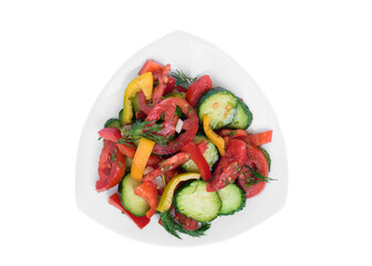 Top view of salad of chopped tomatoes, cucumbers and sweet peppers