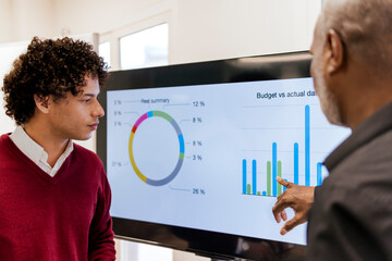 Businessman discussing business strategy with colleague at work place